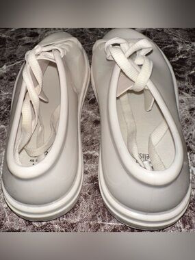 White Lacquered Rubber Ballet Flats with Lace Ties by Melissa